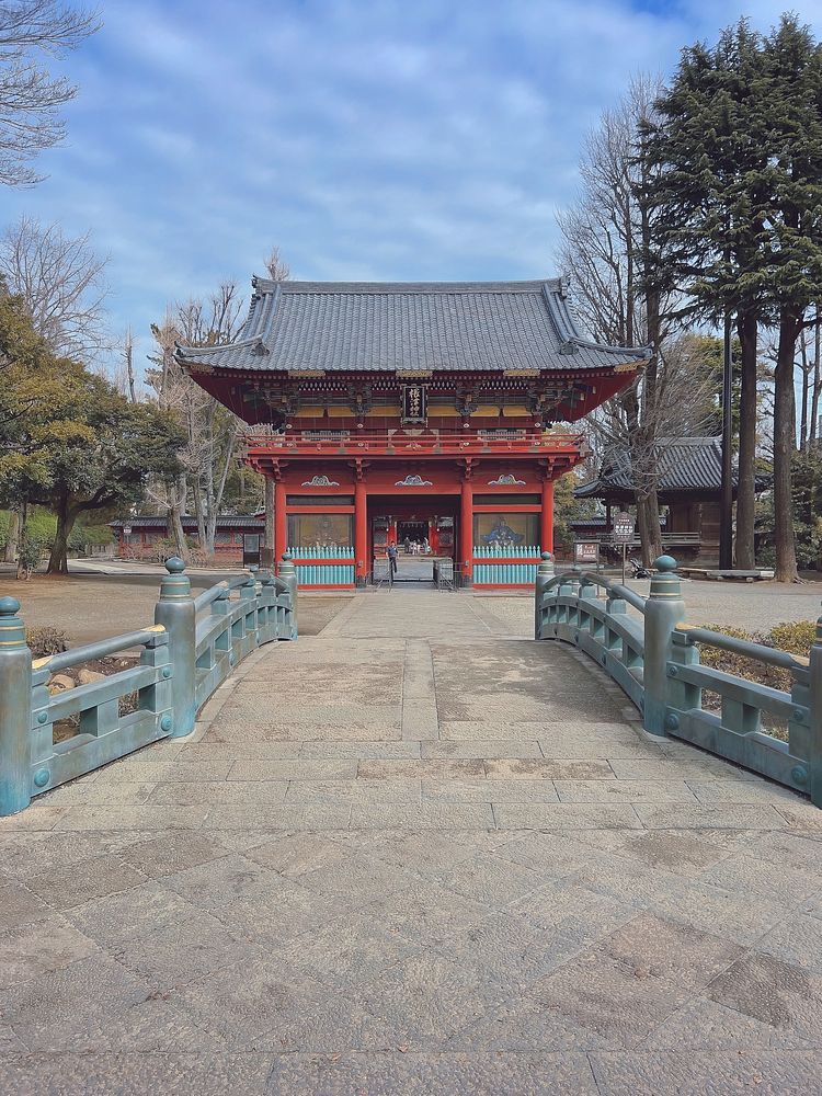 Gate, Nezu Shrine, Tokyo, JapanA beautiful romon (two-storied gate) at Nezu Shrine, Nezu, Bunkyo City, Tokyo, Japan. It was…