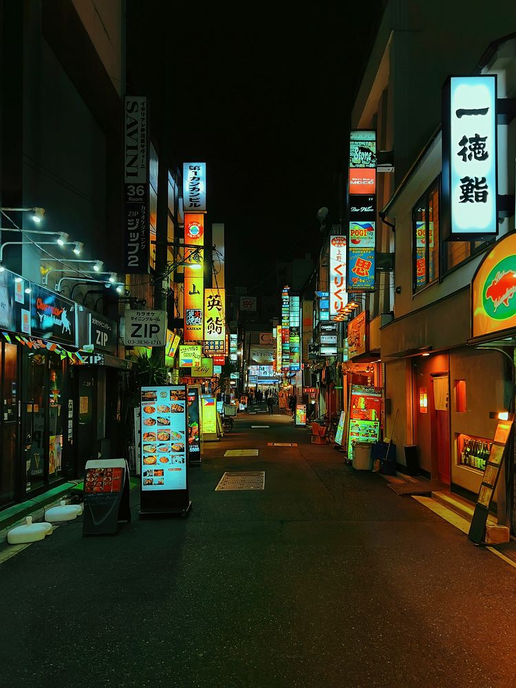 Bar Area, Ueno, Tokyo, JapanNighttime looking down a backstreet lined with neon signs for bars and clubs, Ueno, Taito City…