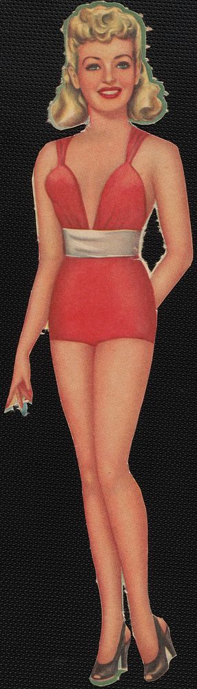             Betty Grable paper doll with one hand behind back          