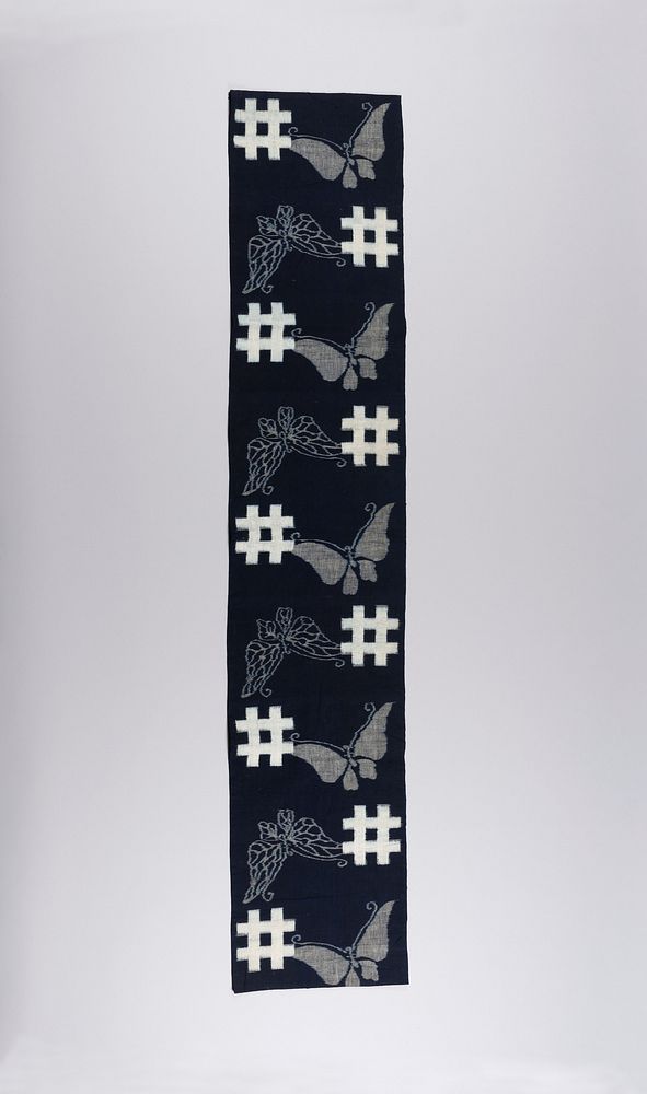 Length of Fabric with Design of Butterflies and Geometric Blocks in the Form of Well Curbs