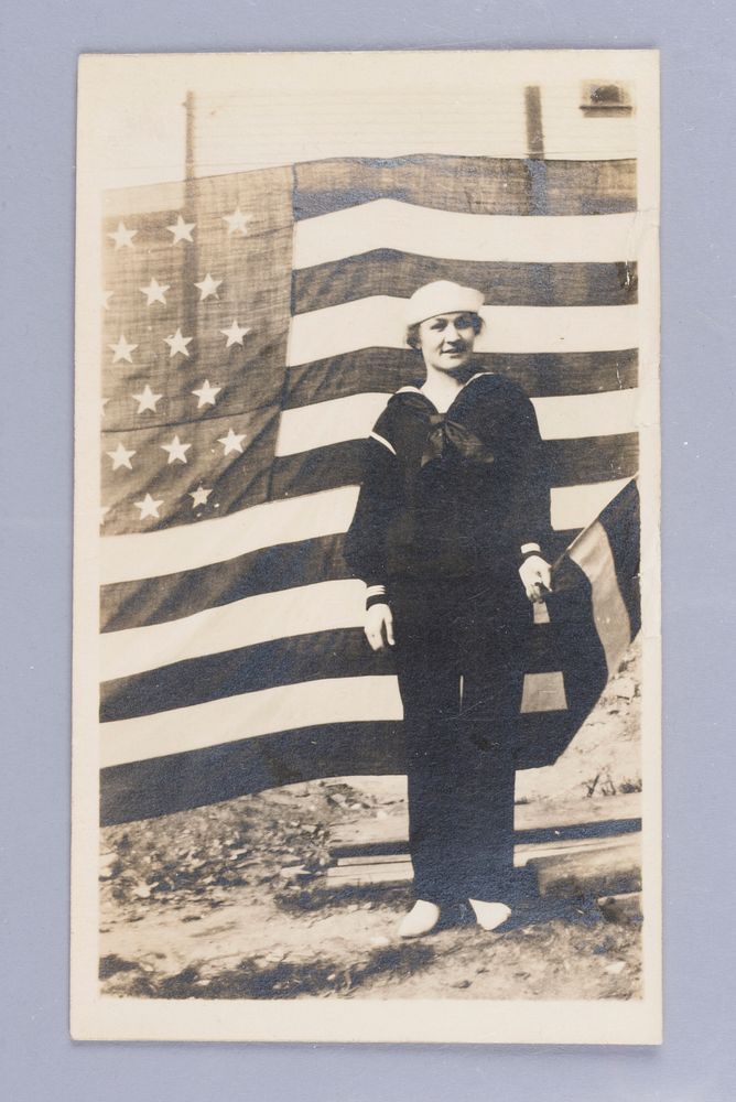 Untitled (Woman in Sailor Uniform in Front of American Flag)