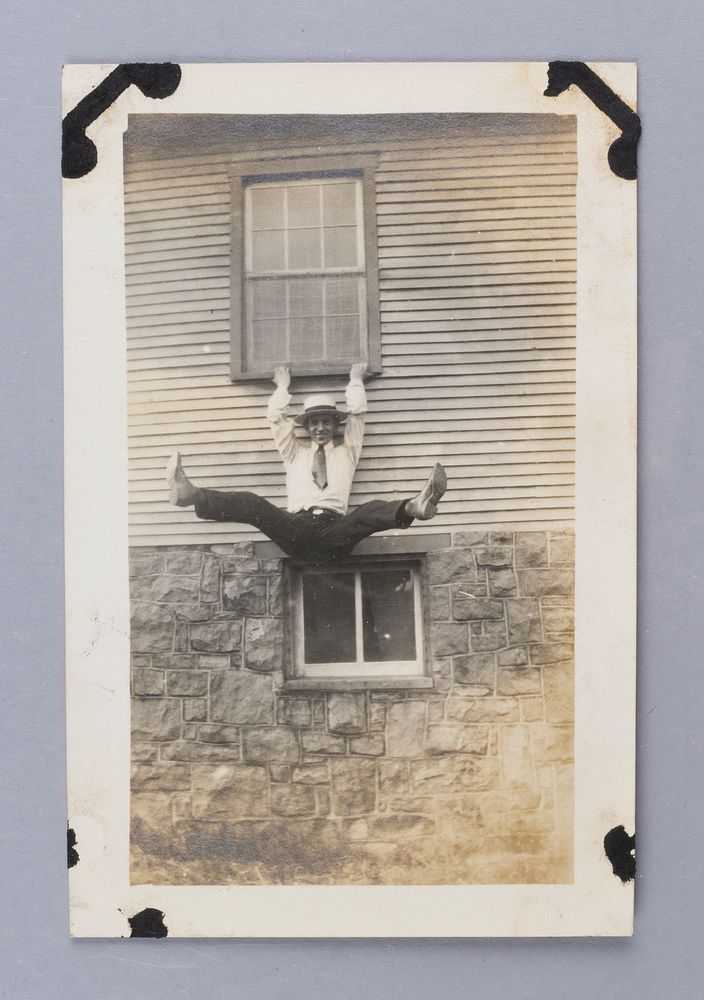 Untitled (Man Hanging Off Window Ledge)