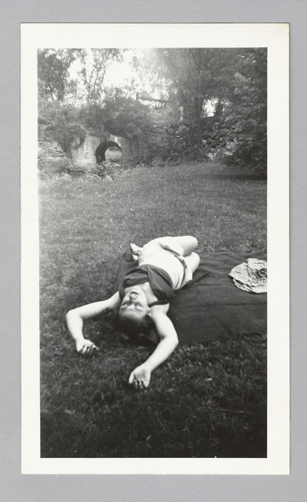 Untitled (woman laying in park)