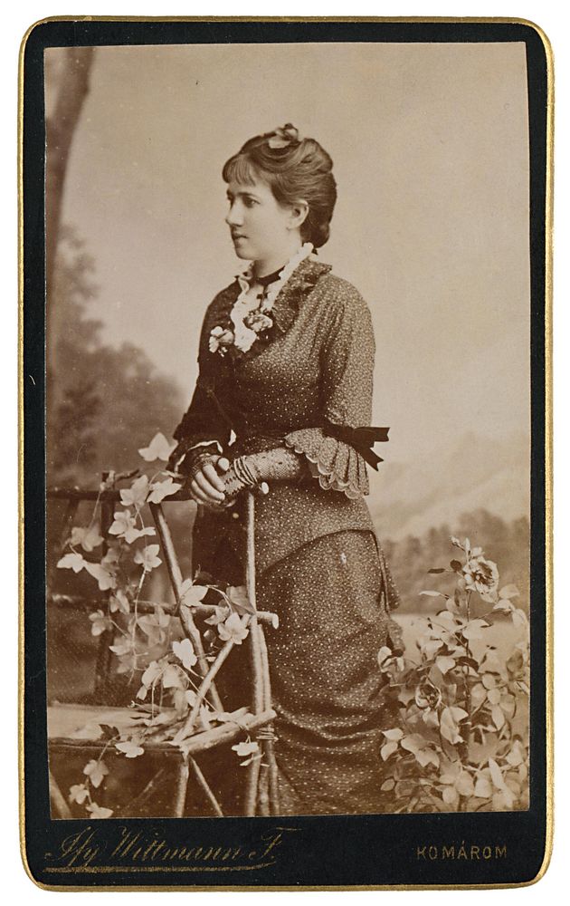 Portrait of a woman at a wicker bench