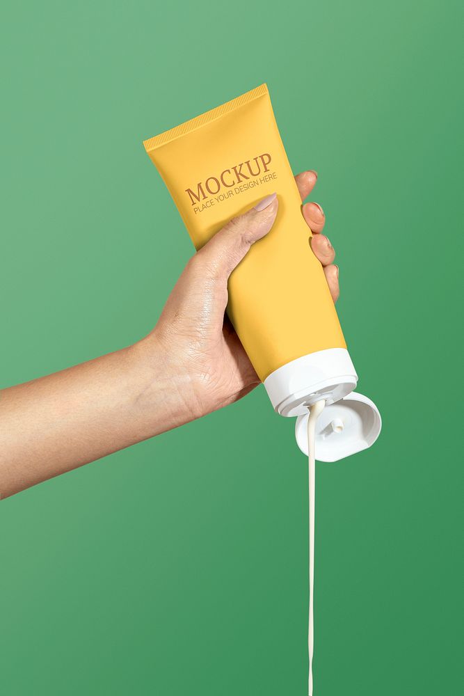 Woman squeezing cream from a yellow tube psd mockup
