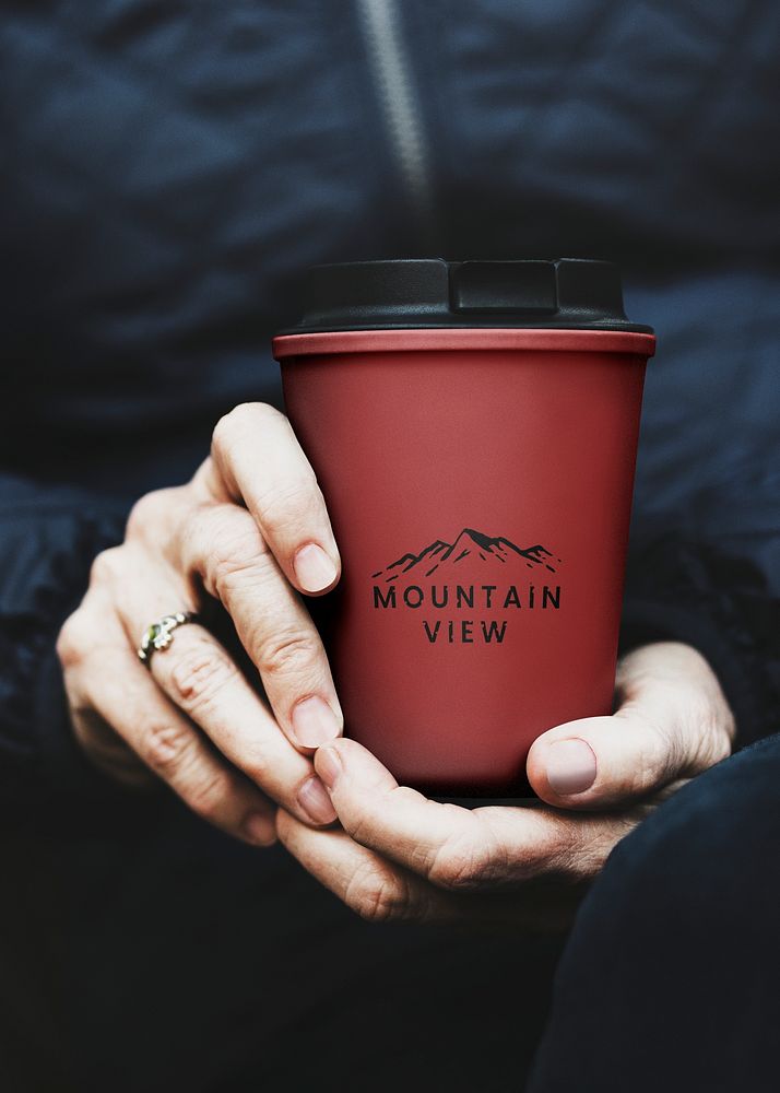 Holding reusable cup mockup psd in red