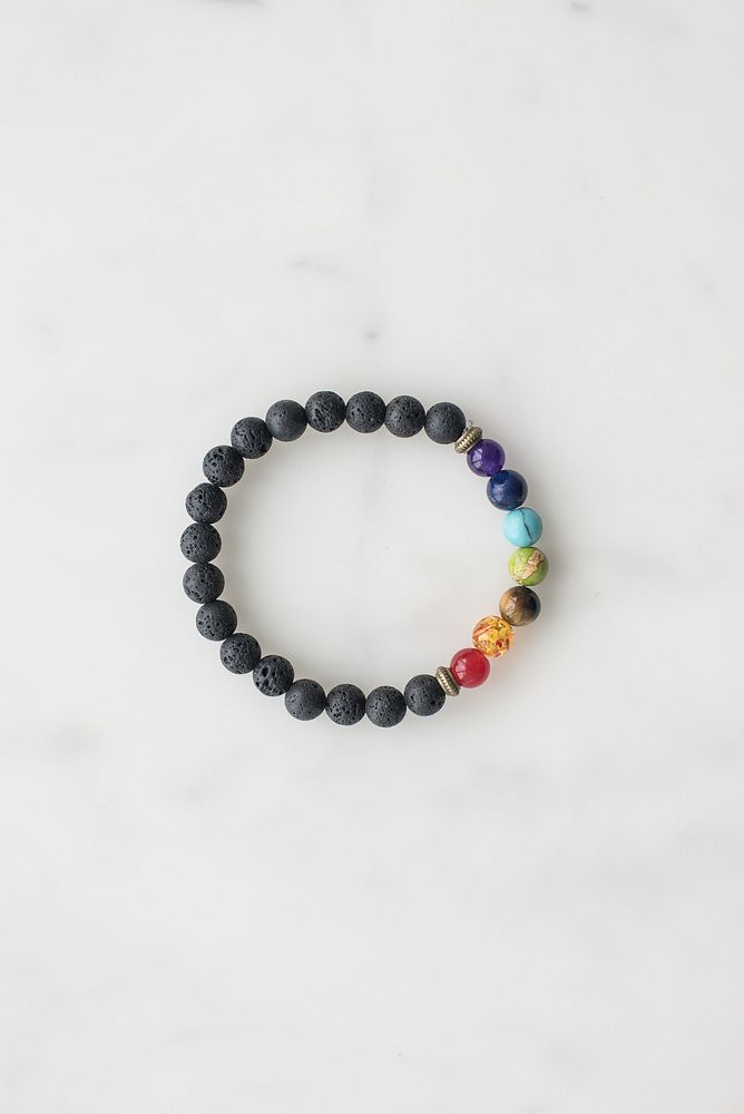 Product photo of 7 chakra bracelet with black beads.