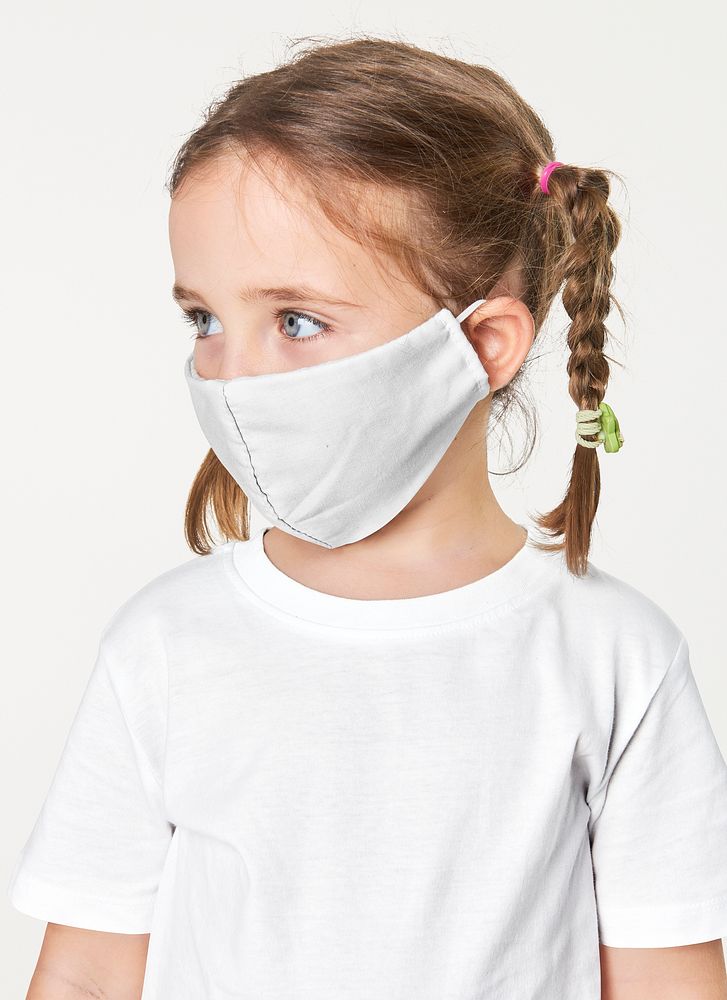 Psd little blonde girl wearing face mask mockup