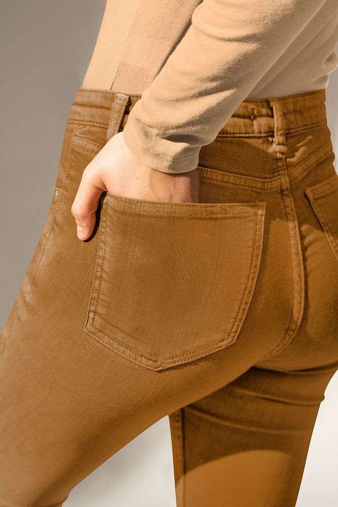 Brown jeans psd mockup hand in pocket women’s apparel shoot rear view