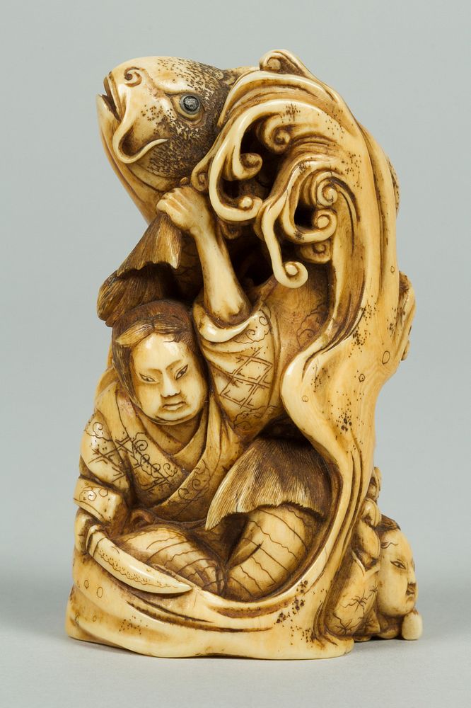 Netsuke of Group of men in the Water holding a Large Carp