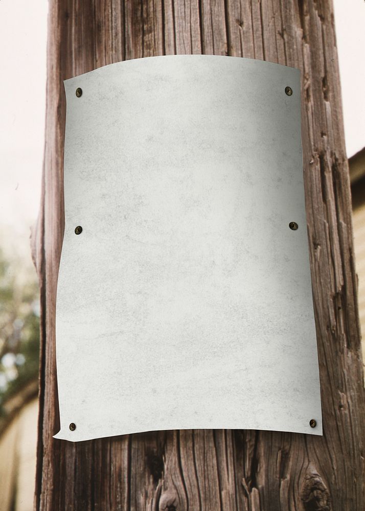 Blank poster on wooden pole