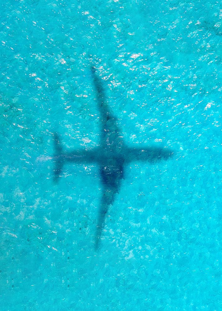 Plane shadow on ocean background