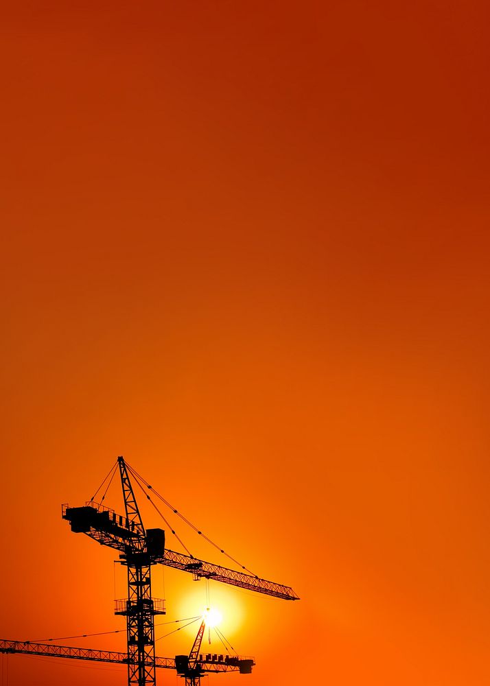 Construction crane, orange background