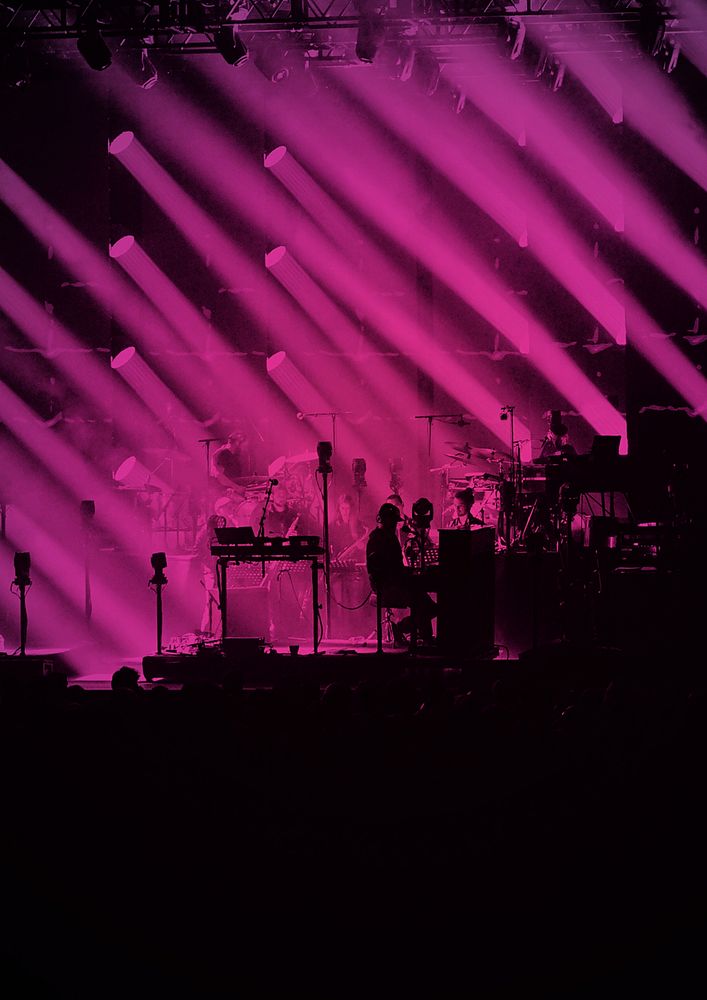 Silhouette concert, pink light background