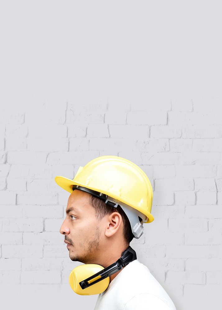 Man with safety helmet, yellow PPE