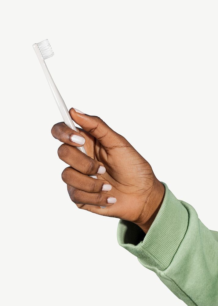 Woman's hand holding toothbrush psd