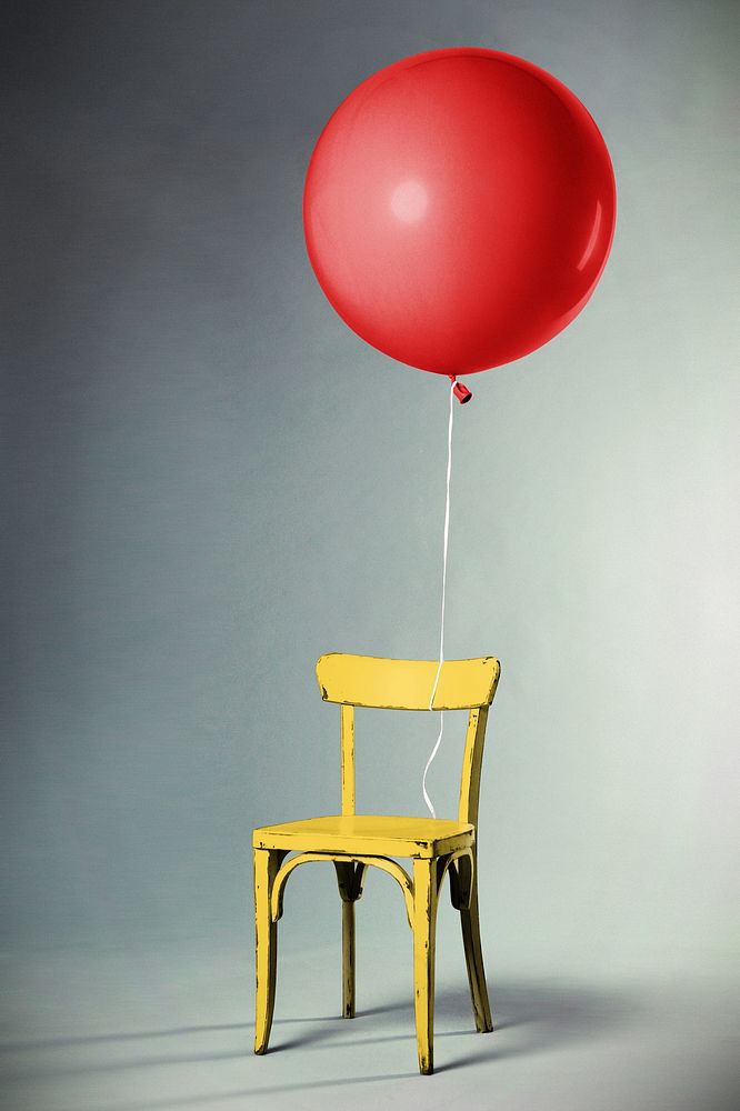Floating balloon with yellow chair