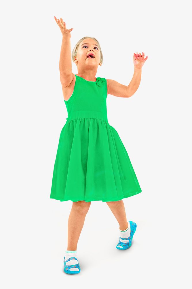 Blonde child in green dress playing catch