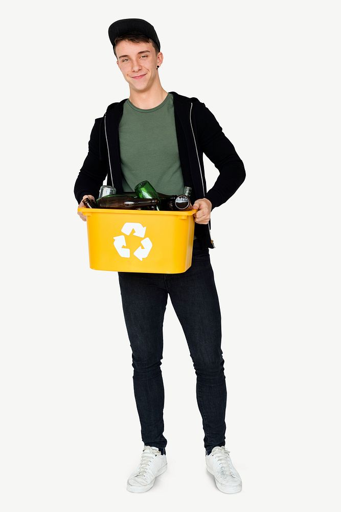 Teen boy holding recycled glasses psd