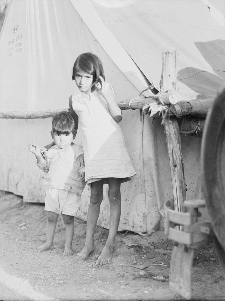 Migrant Mexican children in contractor's camp at time of early pea harvest. Nipomo, California. Sourced from the Library of…