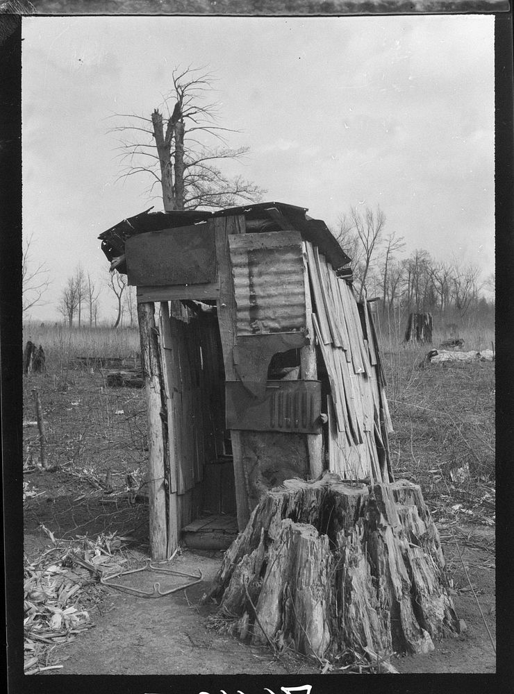 [Untitled photo, possibly related to: Privy on the premises of a  family before they moved to a Farm Security Administration…