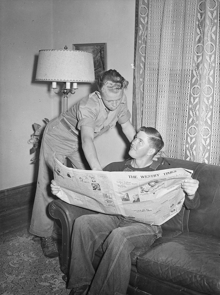 [Untitled photo, possibly related to: Vernon County, Wisconsin. Robert and a hired man discussing news in the parlor after…