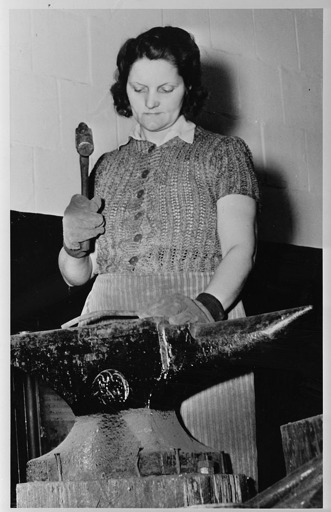 Reading, Pennsylvania. May M. Link, working at the anvil, straightening bolts for reclamation. She can tell the size of the…