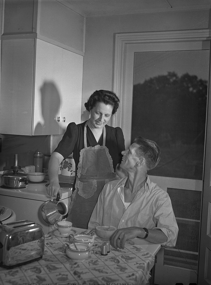 Sheffield, Alabama (Tennessee Valley Authority (TVA)). Mrs. Hall prepares breakfast for her husband before he leaves for…