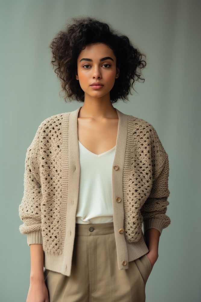 Cardigan sweater contemplation hairstyle. AI generated Image by rawpixel.