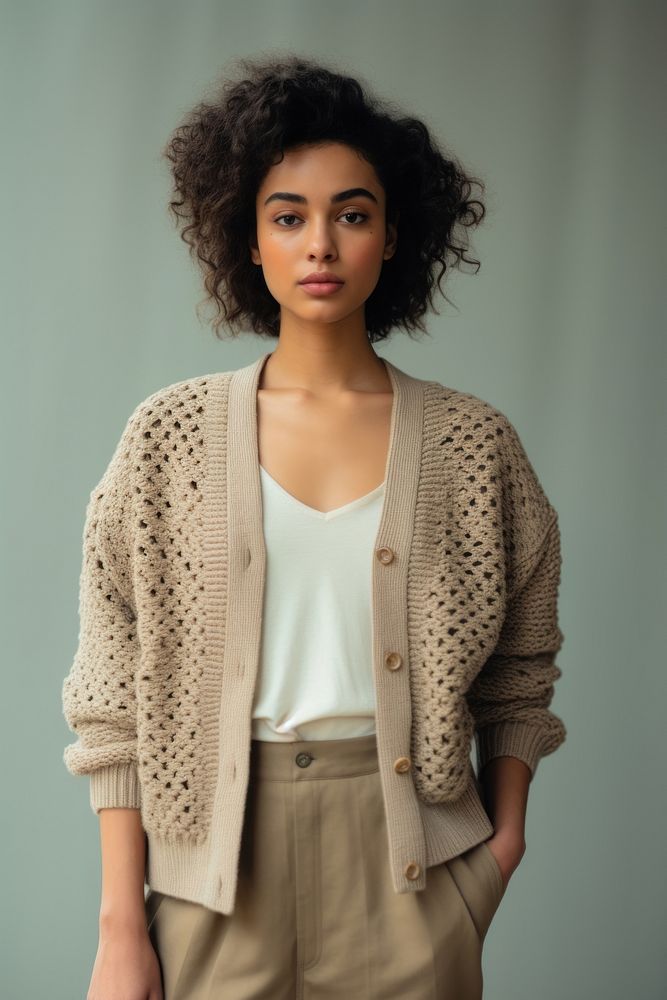 Cardigan sweater contemplation hairstyle. 