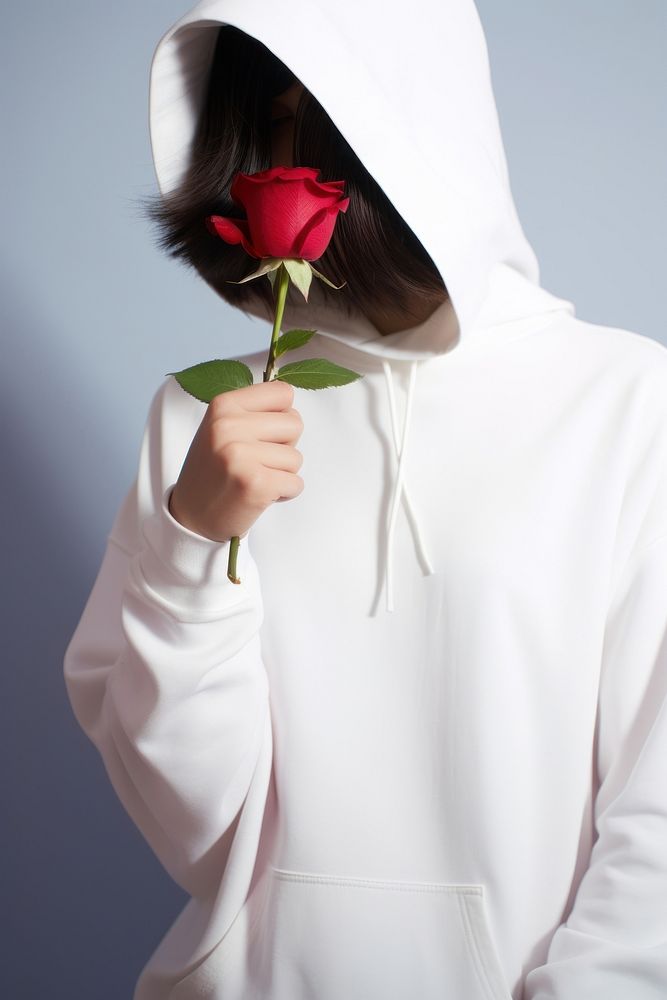 Rose hood sweatshirt holding. 