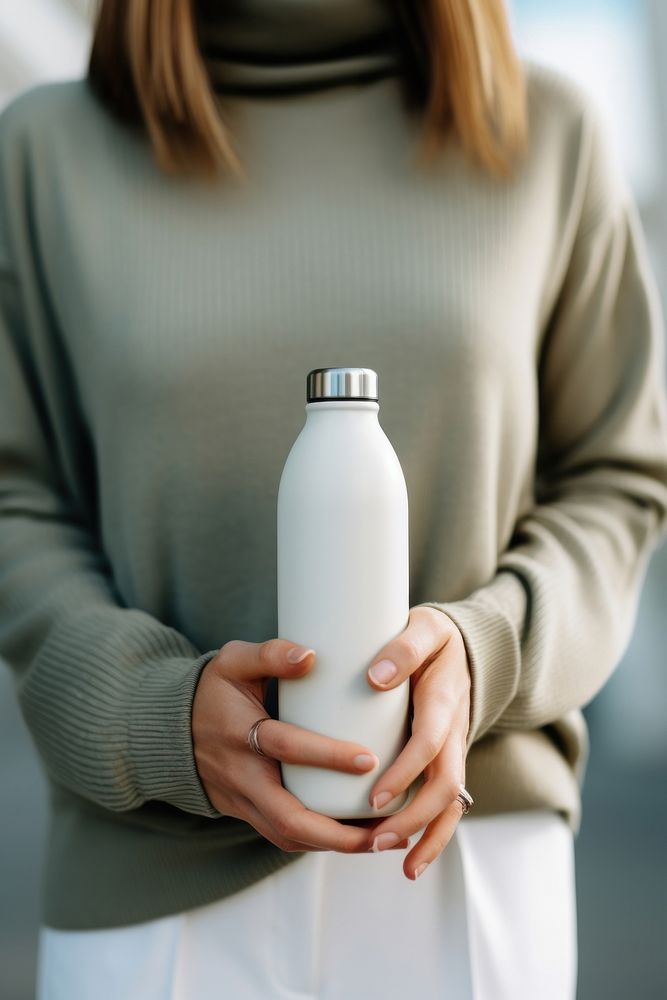 Bottle holding drink milk. AI generated Image by rawpixel.