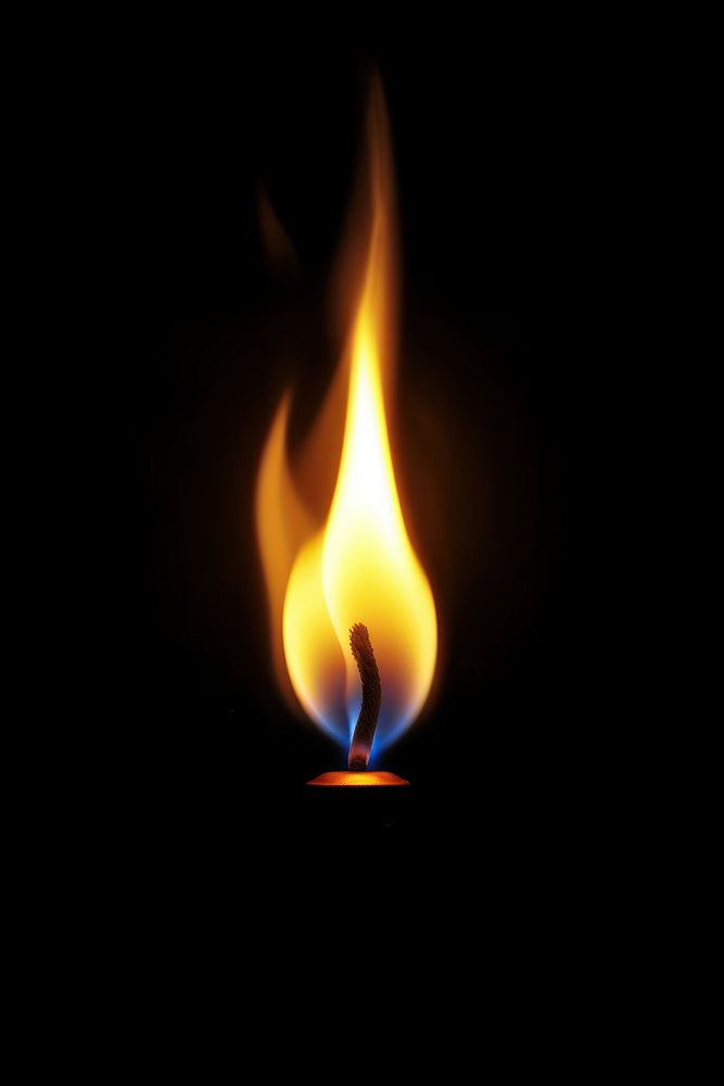 Candle flame fire black background illuminated