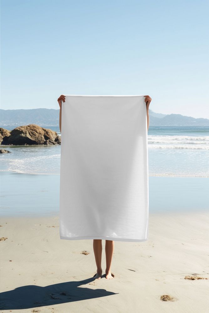Beach towel sand relaxation. 