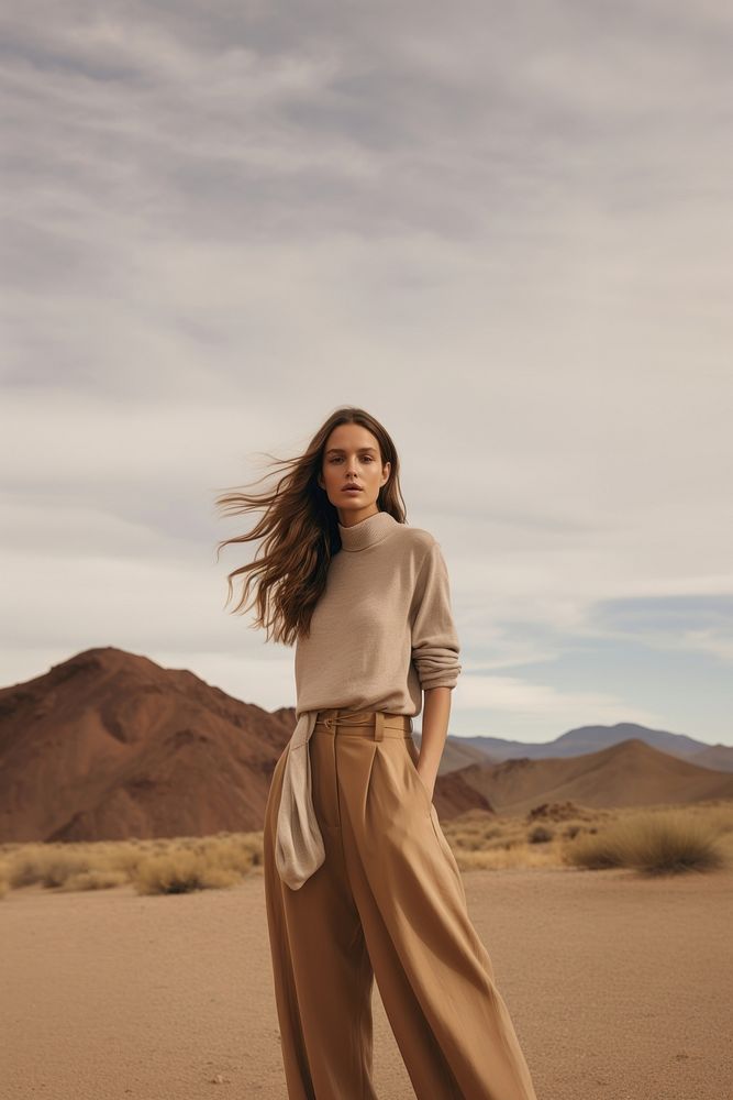 A woman standing wearing a minimal colorful outfit nature outdoors adult. 