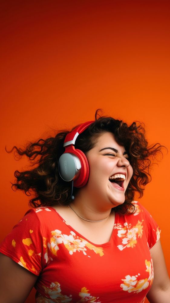 Woman wearing headphones laughing portrait adult. AI generated Image by rawpixel.