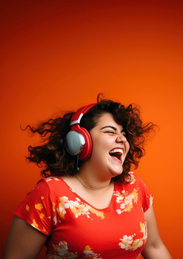 Woman wearing headphones laughing adult performance. AI generated Image by rawpixel.