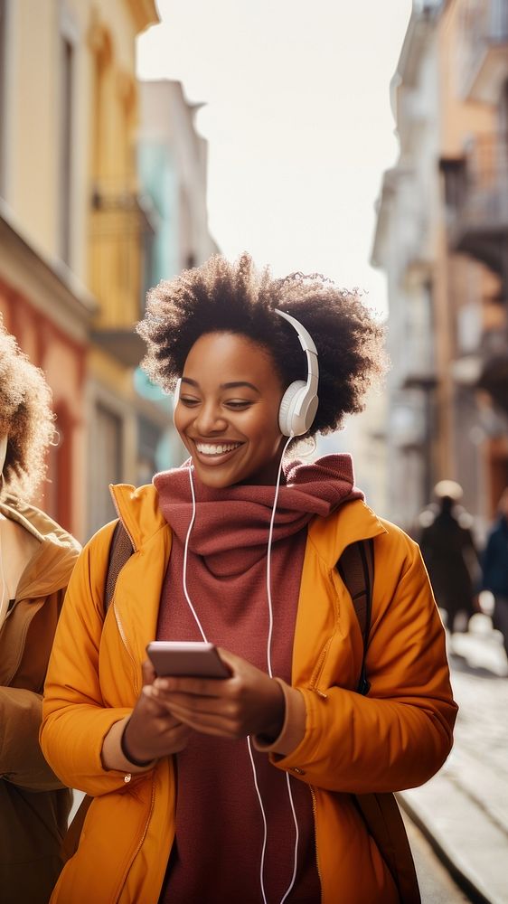 Two female black friends headphones adult architecture. 