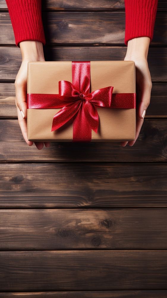 Woman holding a red christmas present celebration decoration surprise. 