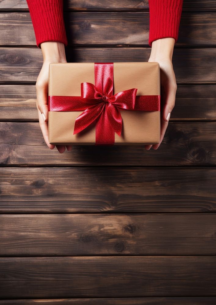 Woman holding a red christmas present box celebration decoration. 