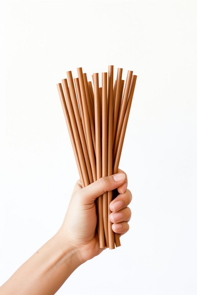Paper straws holding brown hand. AI generated Image by rawpixel.