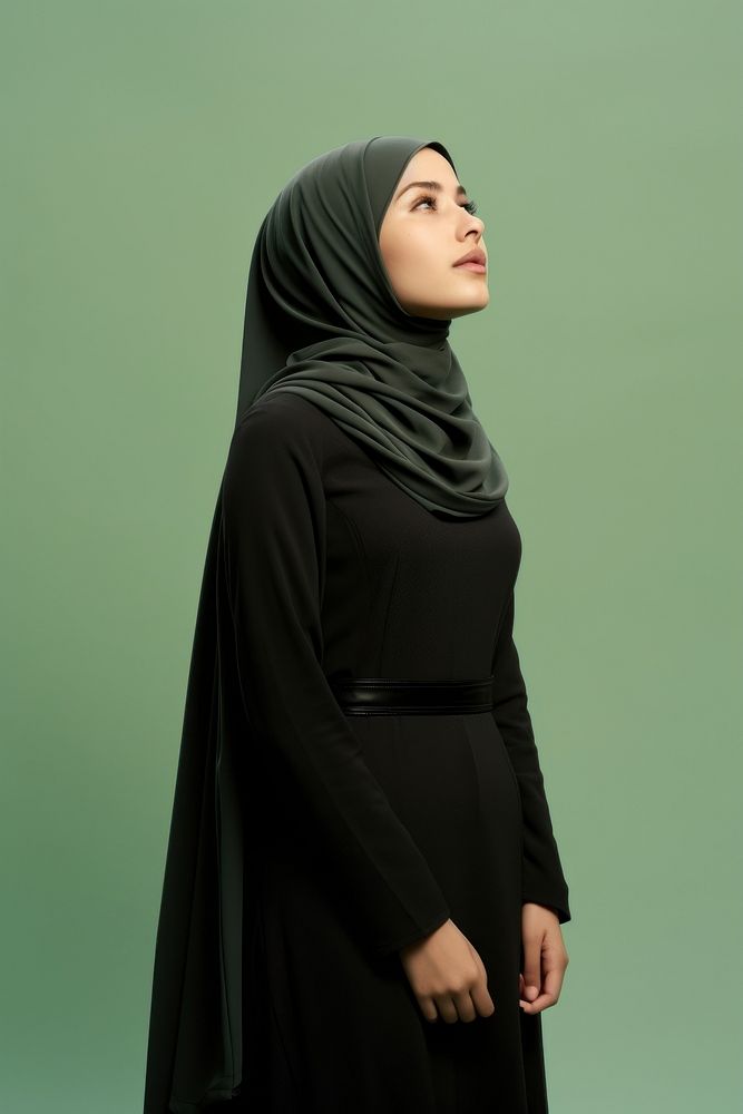 Black hijab standing fashion sleeve. AI generated Image by rawpixel.
