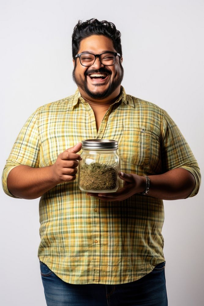 Male holding marijuana glasses adult white background. 