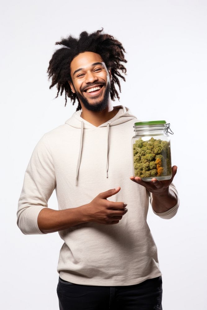 Male holding marijuana jar adult happy. AI generated Image by rawpixel.