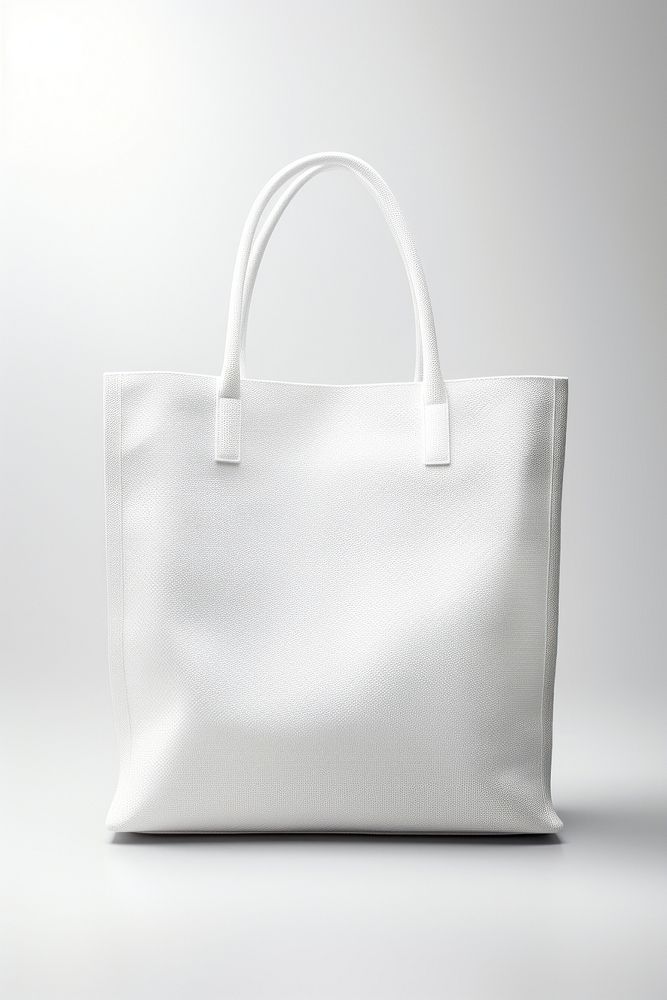A white canvas tote bag handbag white background accessories. AI generated Image by rawpixel.