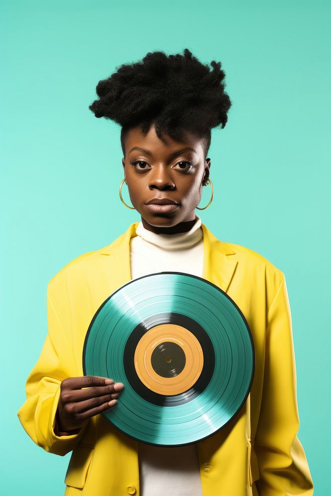 African afrobeat singer holding a small record portrait yellow adult. 