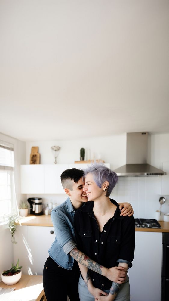Smiling lesbian couple portrait kitchen kissing. AI generated Image by rawpixel.