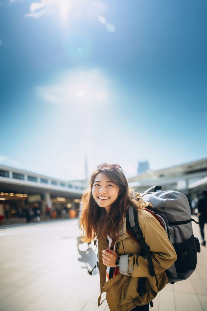 Dragging baggage outdoors smiling photo. 