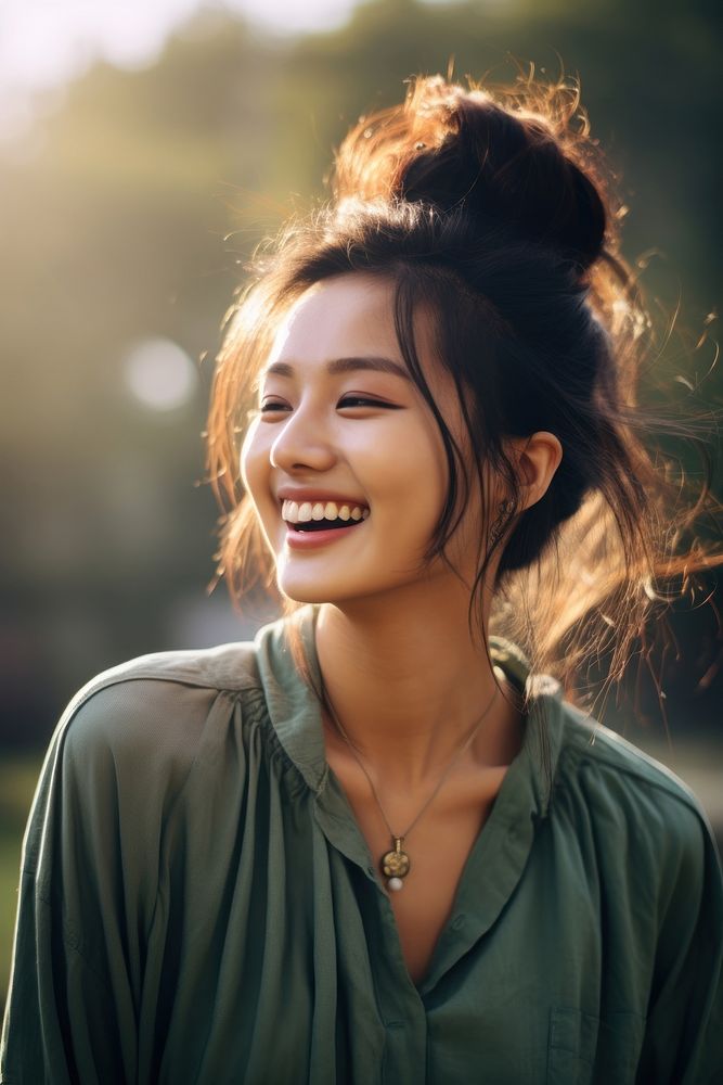 Young chinese woman laughing portrait smile. 