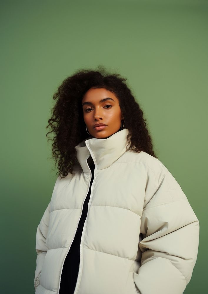 Black woman wearing a white puffer jacket portrait adult photo. 